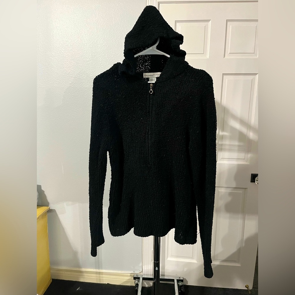 Woman’s Black 100% Polyester knit hooded zip down sweater